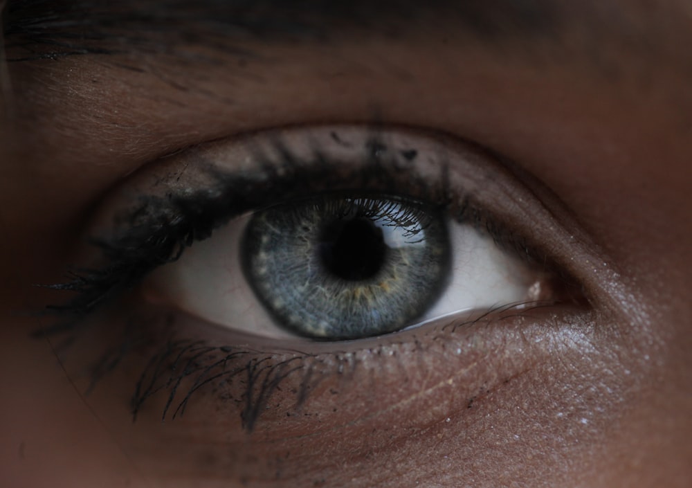 persons eye in close up photography