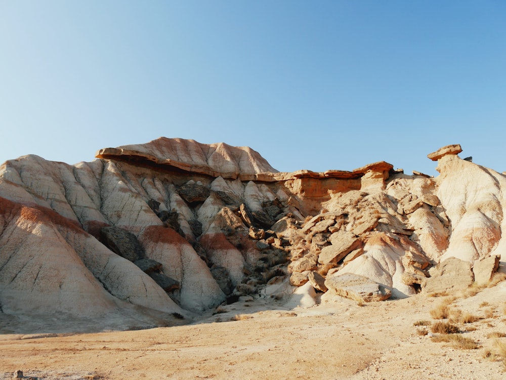 brown rock formation under blue sky during daytime