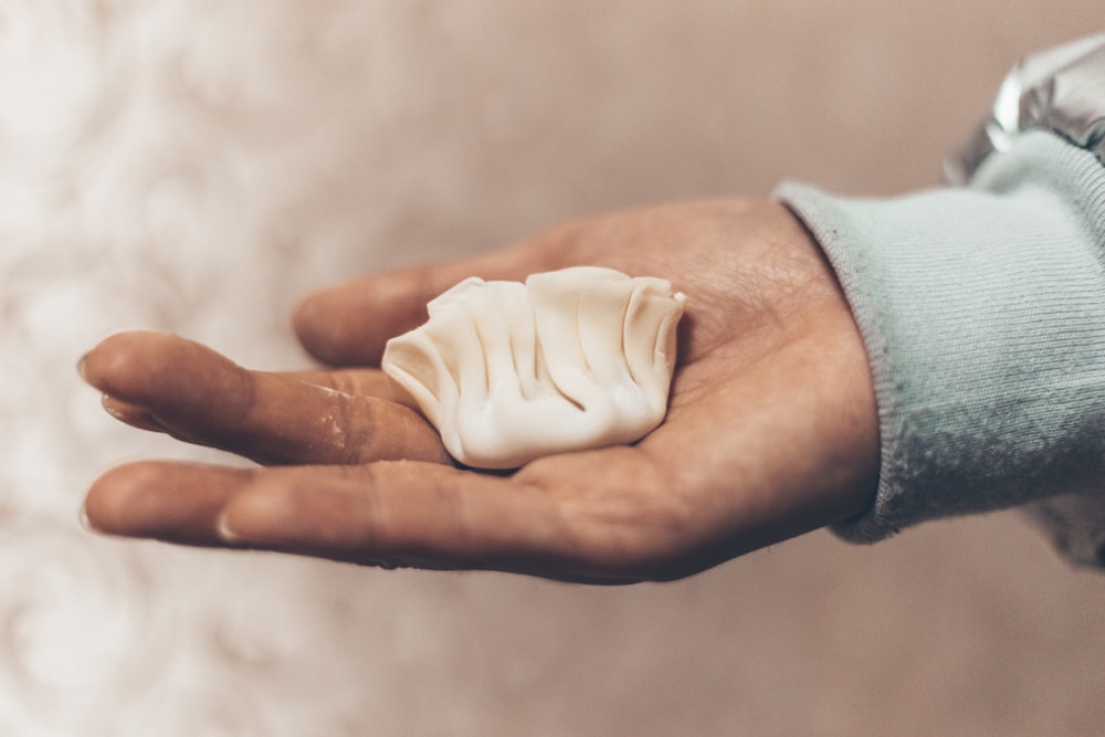 persons hand with white powder