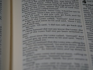 A close-up view of a page from a book with text clearly visible, discussing a narrative involving characters Samuel and Eli.