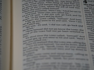 A close-up view of a page from a book with text clearly visible, discussing a narrative involving characters Samuel and Eli.