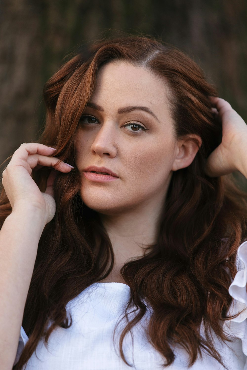 woman in white long sleeve shirt