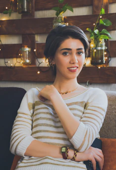 A calm person setting boundaries with a gentle, confident expression in a cozy home environment.
