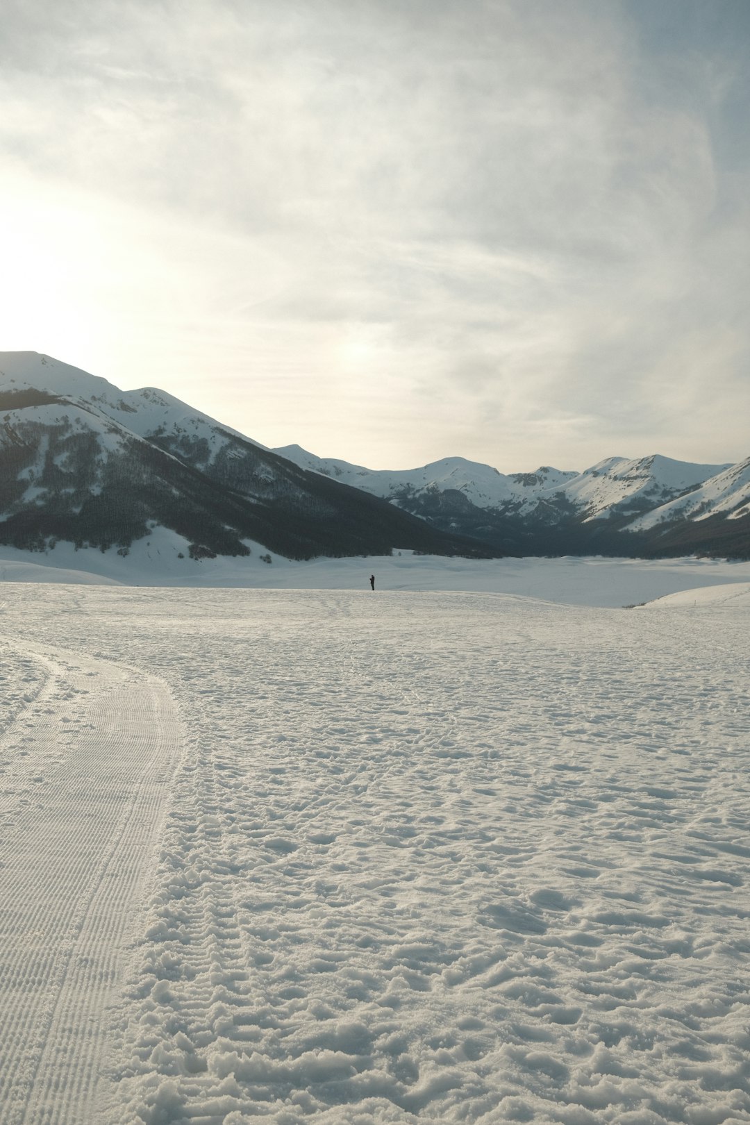 people walking on snow covered field during daytime