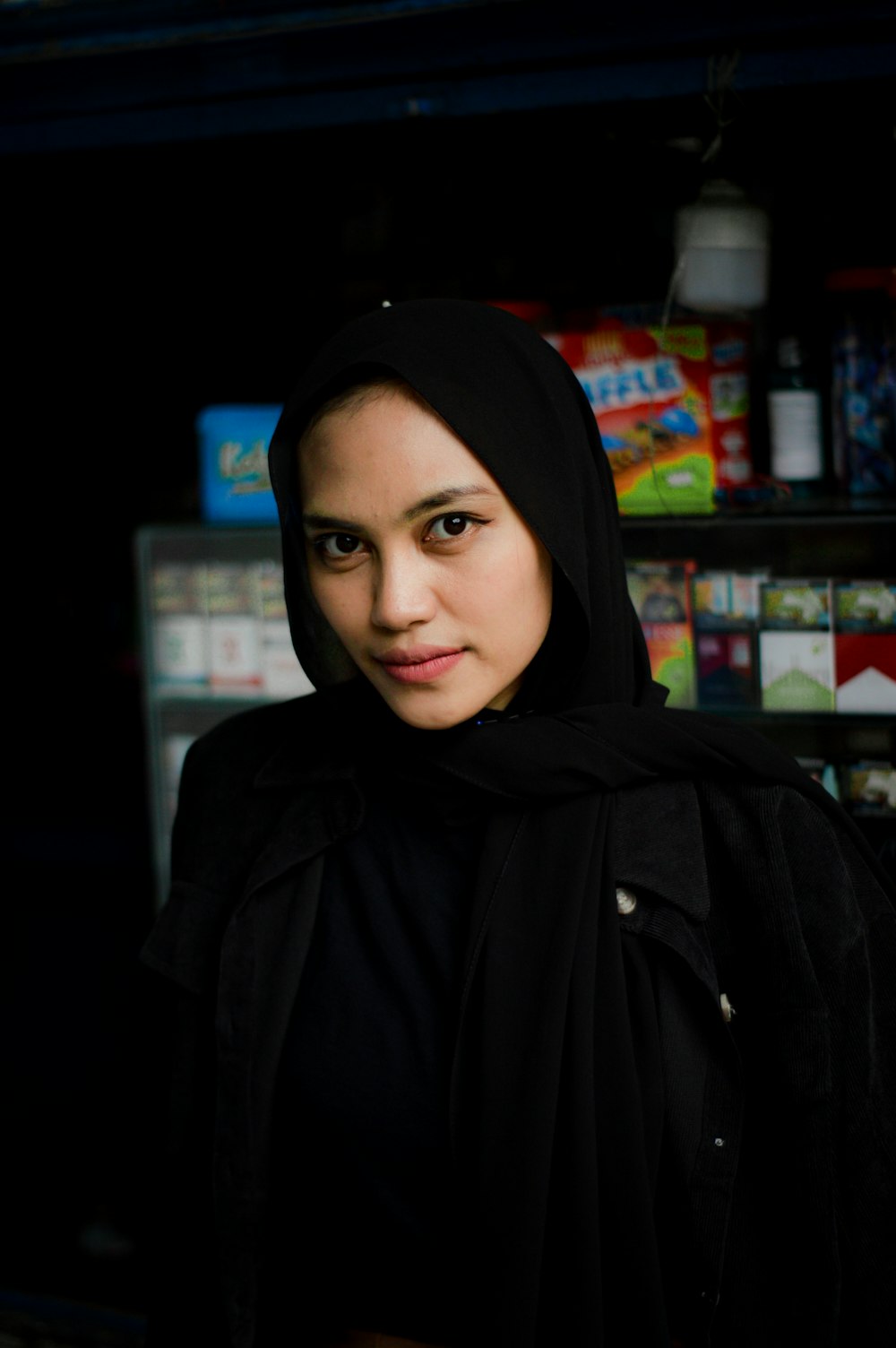 woman in black hijab and black abaya