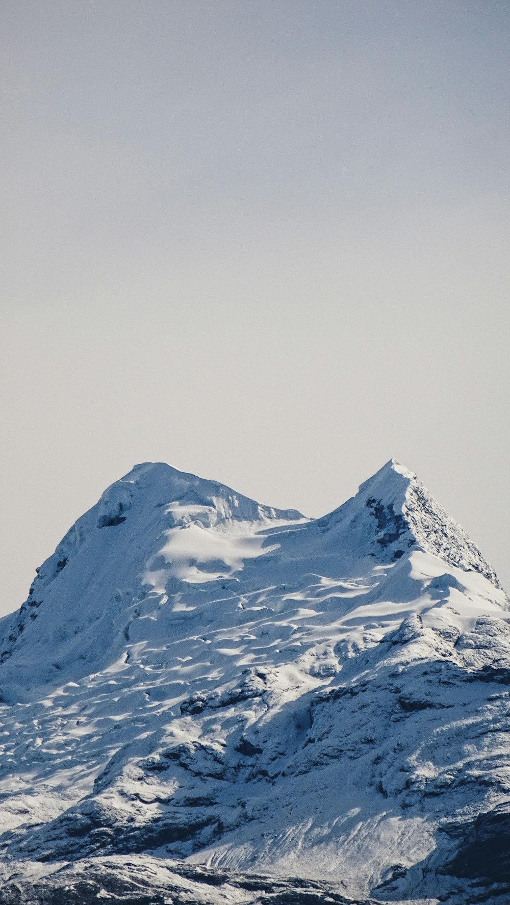 snow covered mountain during daytime