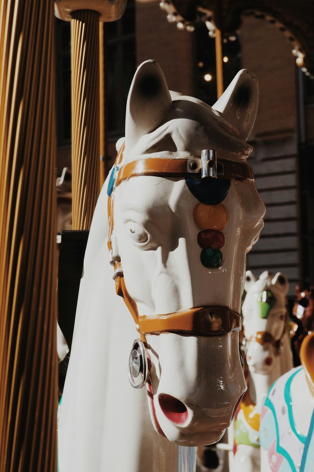 white horse with brown leather saddle