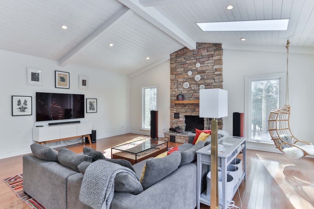 gray sofa chair near brown wooden table