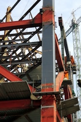 Steel structure framework being assembled at an industrial construction site.