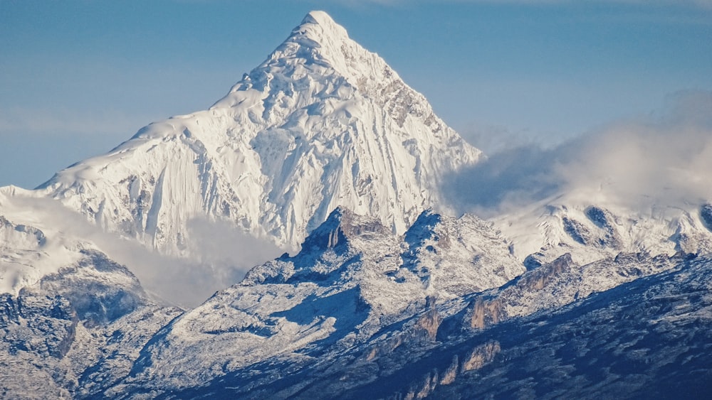 snow covered mountain under blue sky during daytime