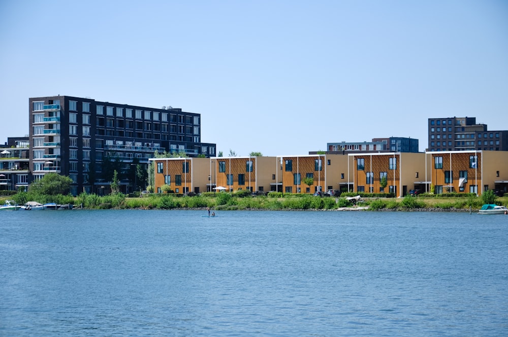 body of water near buildings during daytime