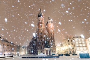 brown concrete building with lights turned on during night time