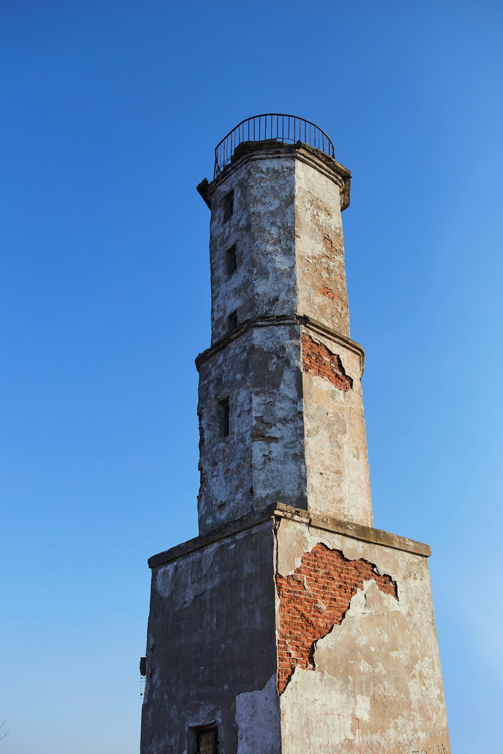 brown concrete tower under blue sky during daytime