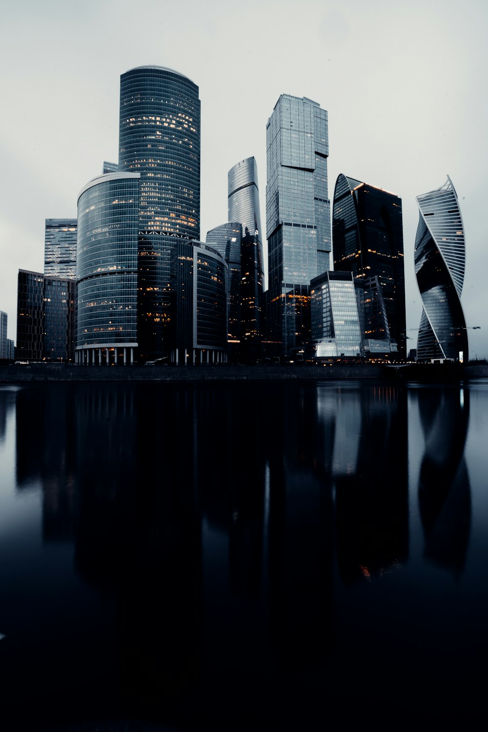 city skyline across body of water during daytime