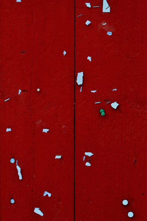red wooden door with white heart shaped