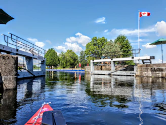 white and brown wooden bridge over river during daytime