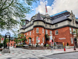 A historic building with a digital token icon hovering above.