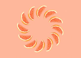 orange fruit with pink background