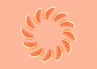 orange fruit with pink background