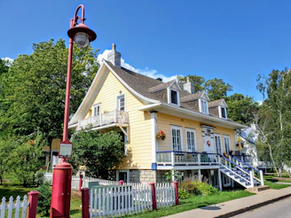 A charming historic home with a white picket fence and blooming garden in St. Augustine.