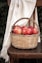 red apples in brown woven basket