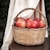 red apples in brown woven basket