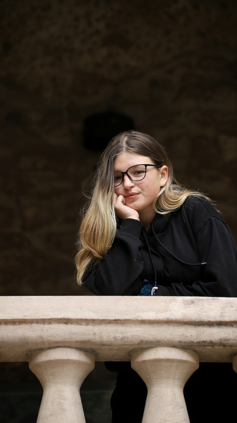 woman in black jacket wearing eyeglasses