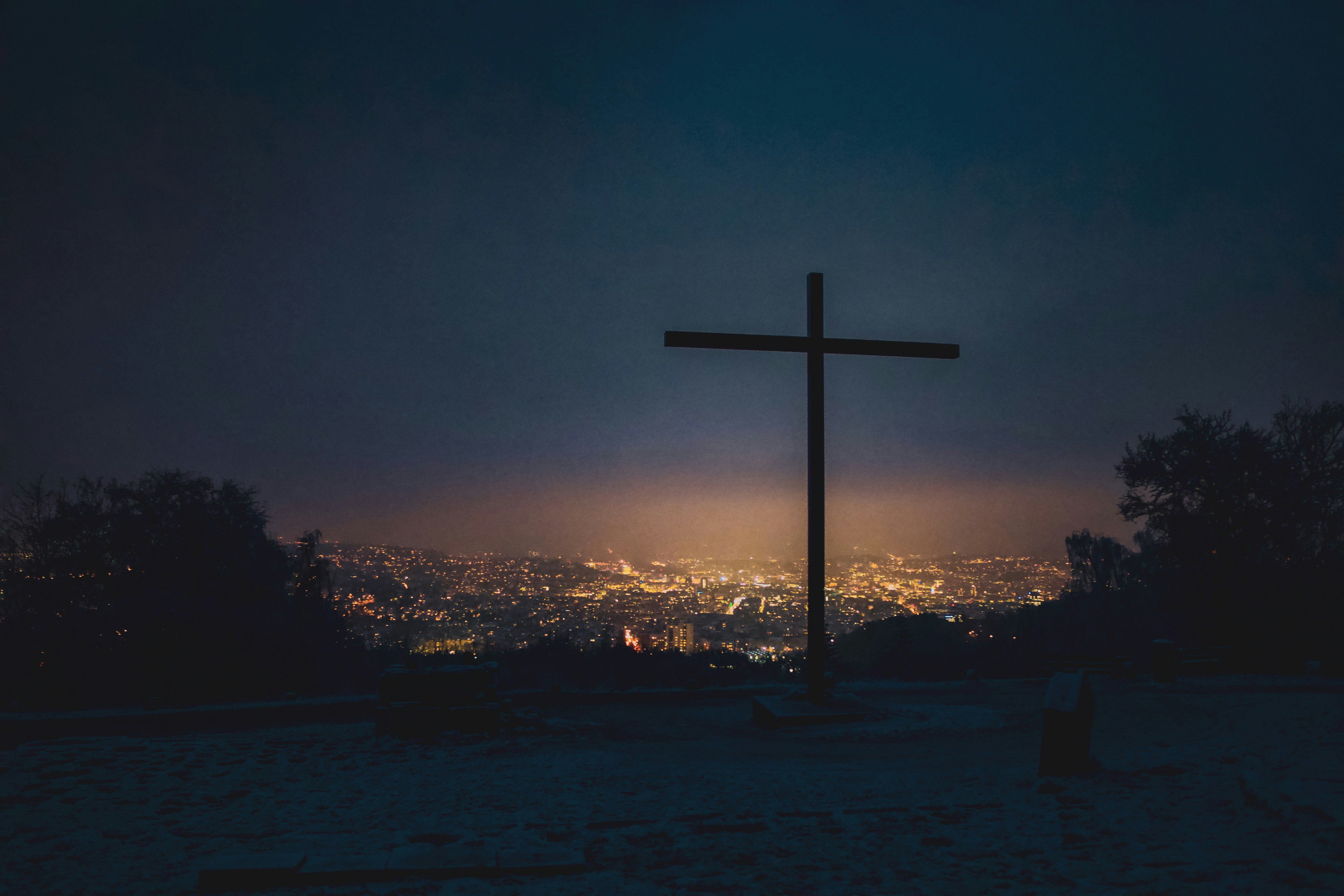 silhouette of cross during sunset