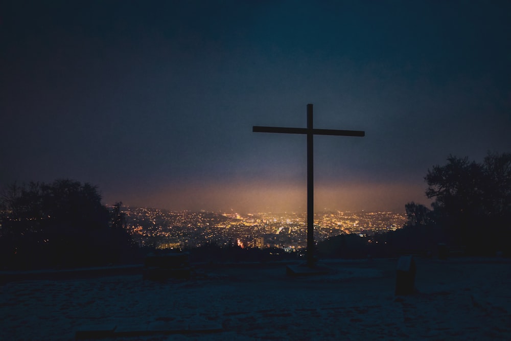 silhouette of cross during sunset