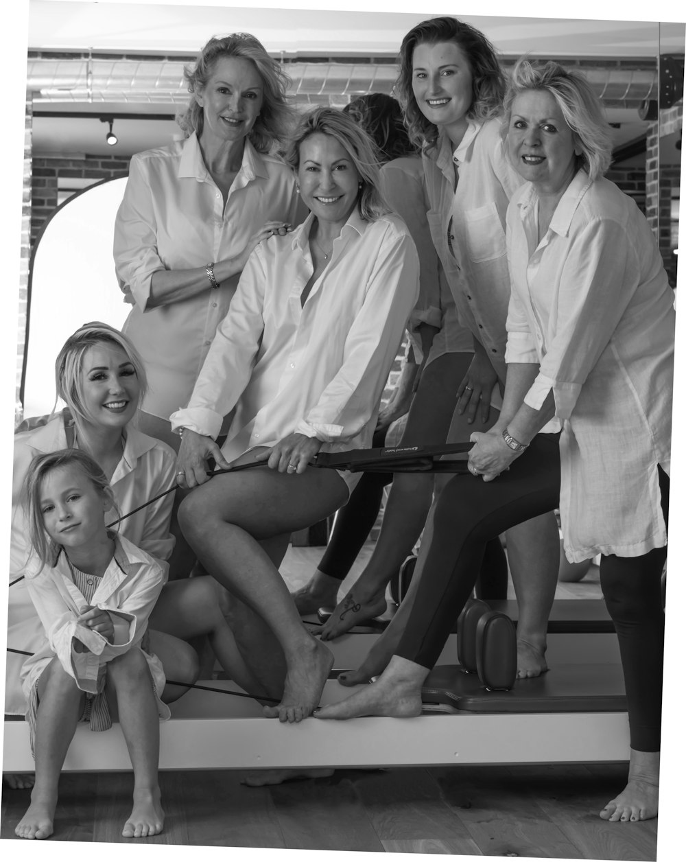 grayscale photo of 4 women sitting on the floor