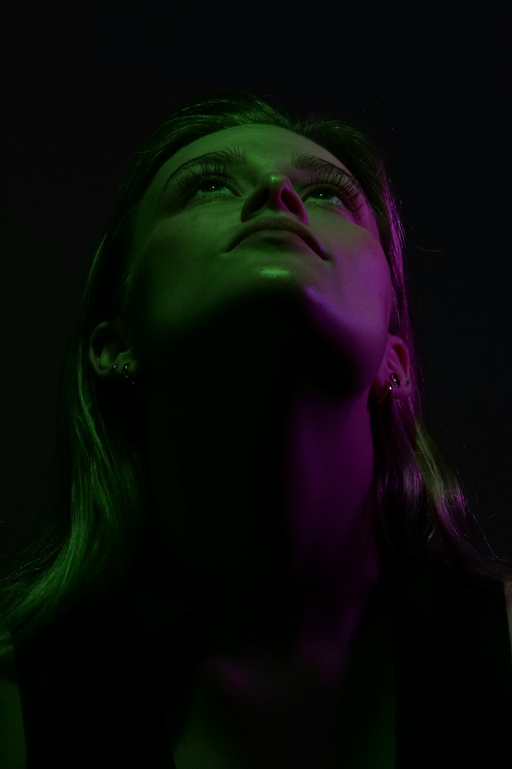 woman with purple and green face paint