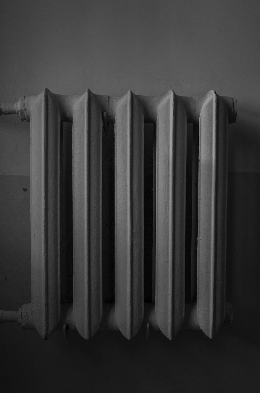 white radiator heater on white wall