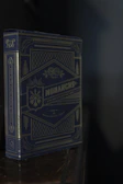 A premium deck box featuring embossed details and rich color tones.
