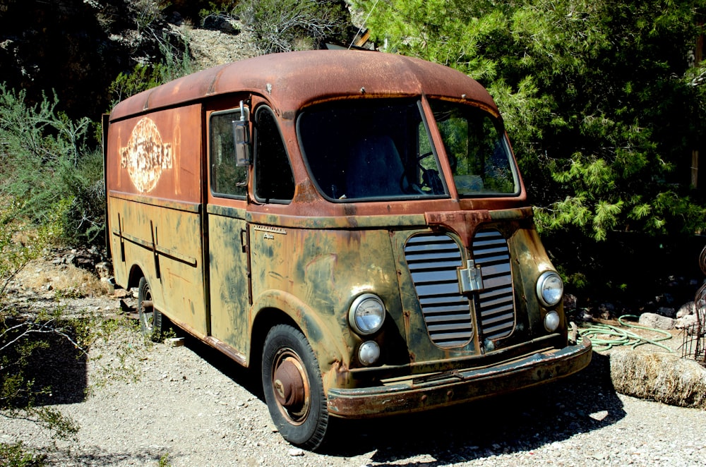 brown van on gray asphalt road during daytime