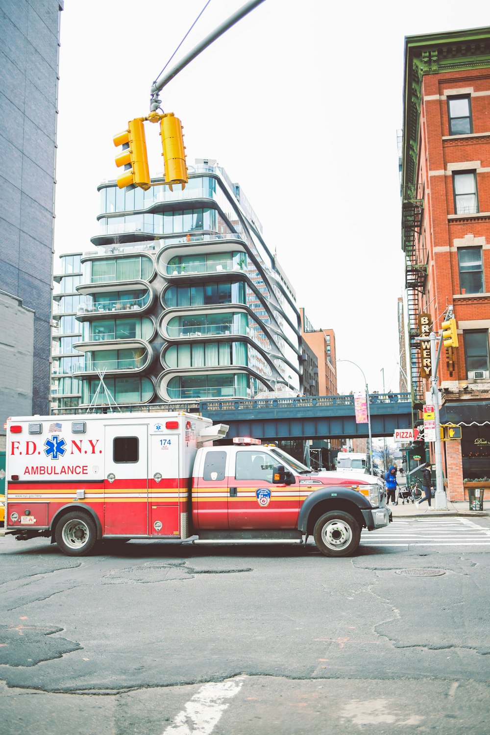 red and white van on road near building during daytime