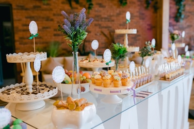 A beautifully arranged candy table with assorted sweets and treats.