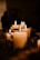 white pillar candles on black holder