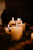 white pillar candles on black holder