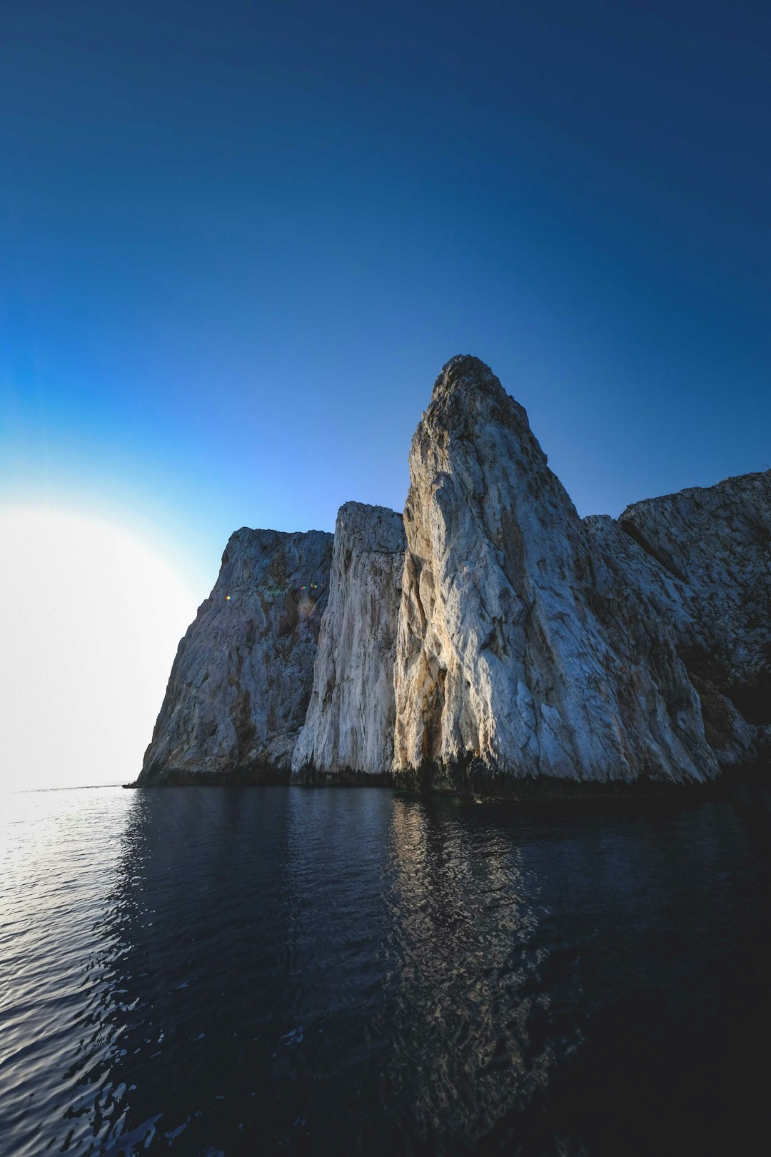 brown rock formation on sea during daytime