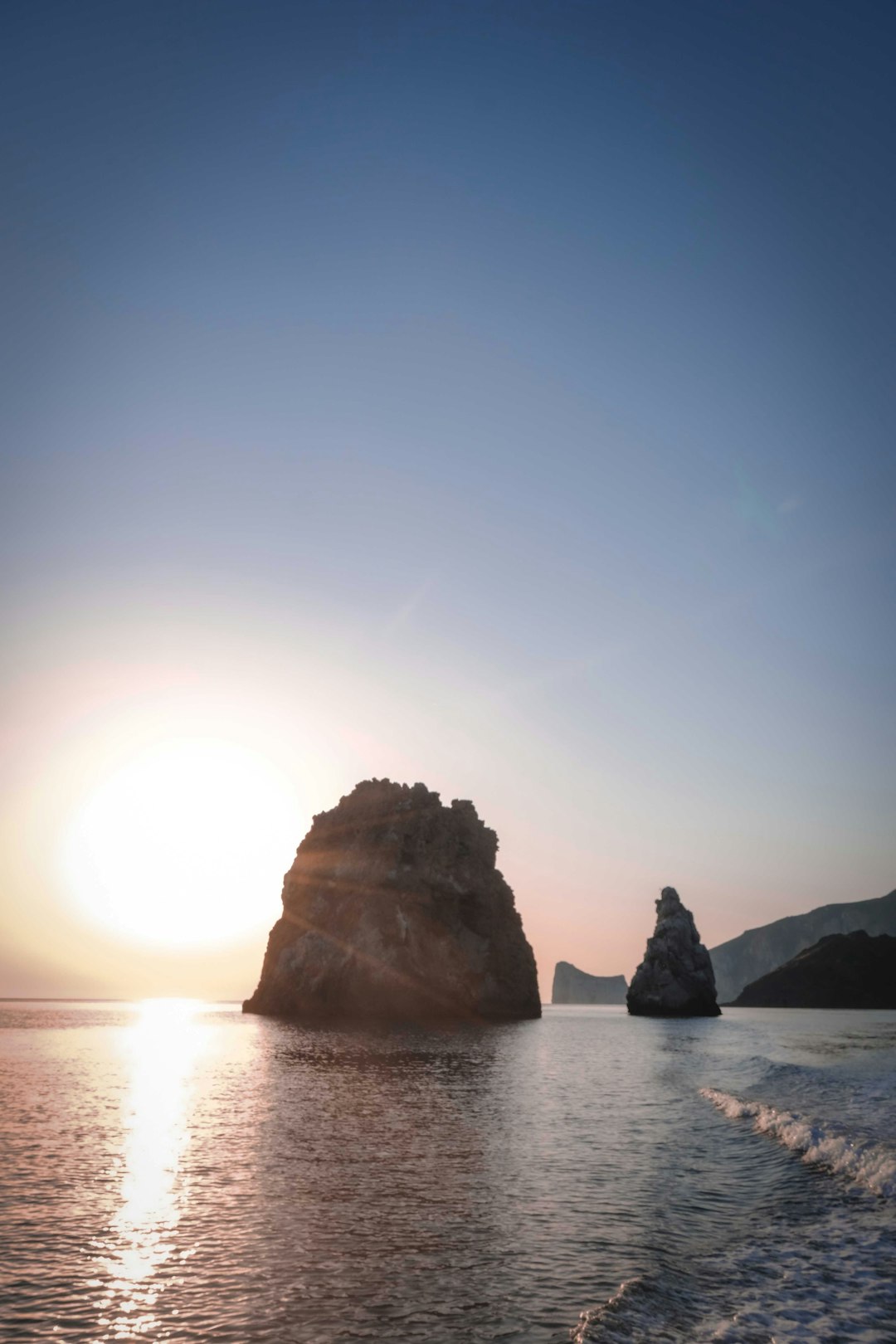 brown rock formation on sea during daytime