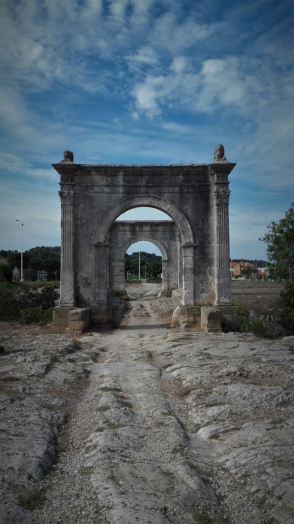 gray concrete arch under blue sky during daytime