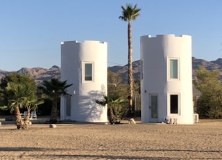 white concrete building near green trees during daytime