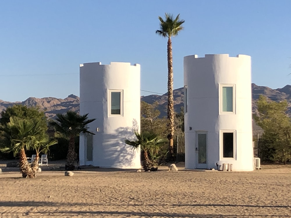 white concrete building near green trees during daytime