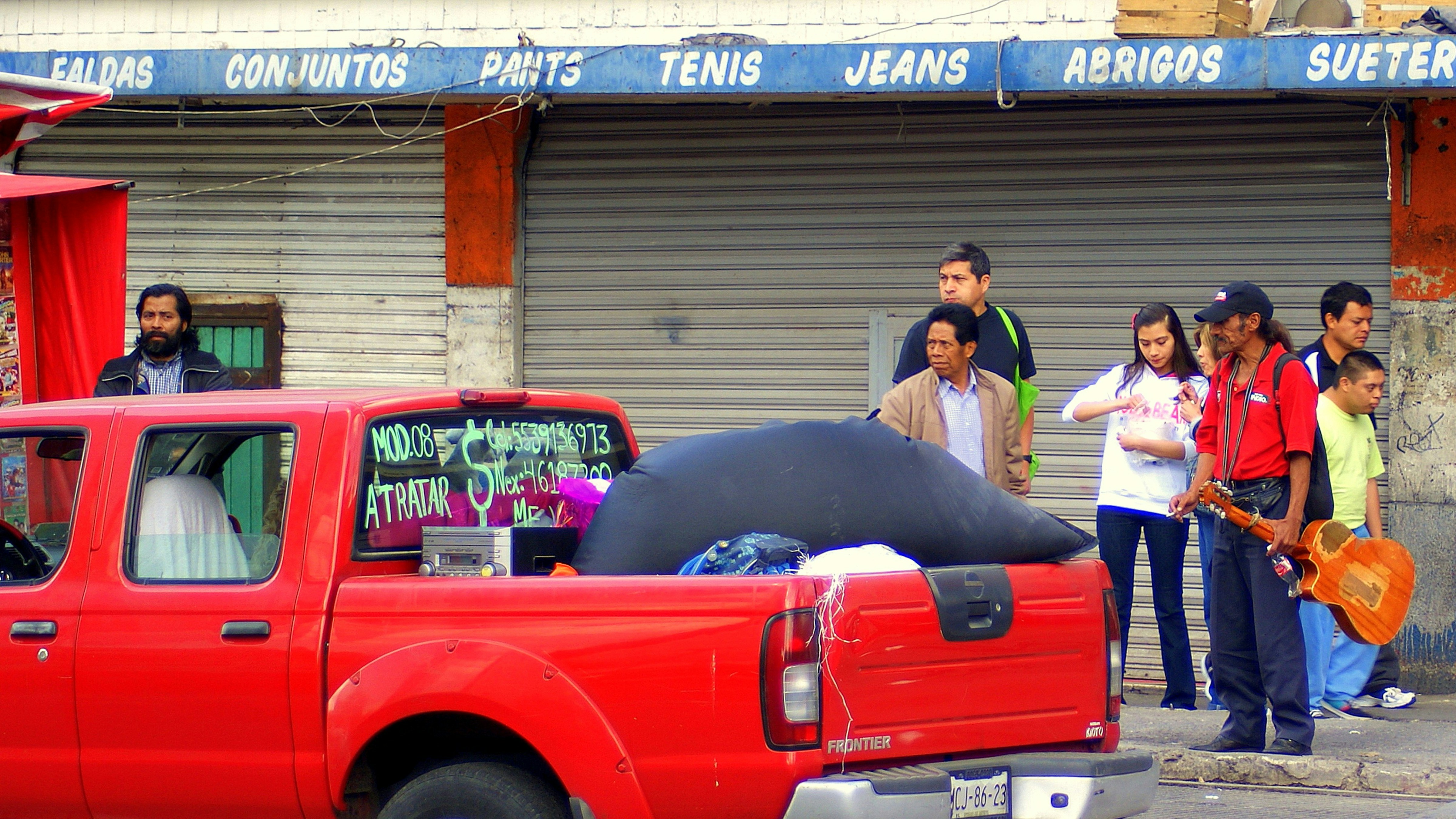 Young volunteers washing cars to raise funds