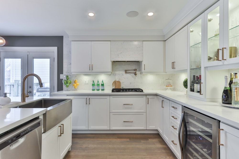 white wooden kitchen cabinet and white kitchen cabinet