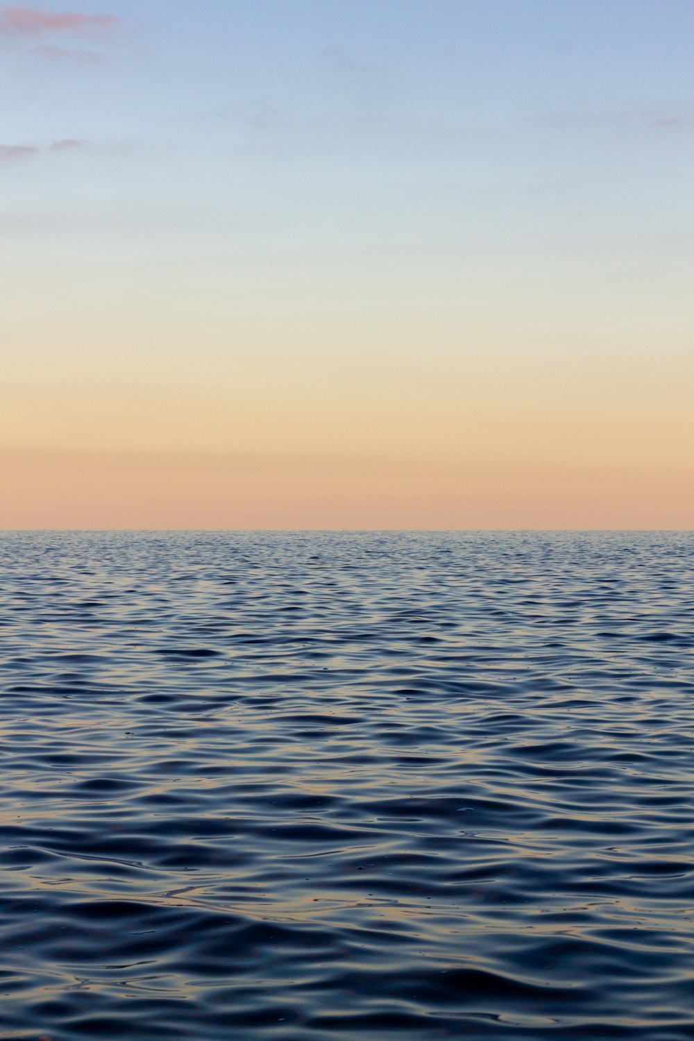 body of water during sunset