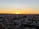 A vibrant sunset over a city skyline, showcasing the beauty of urban life.