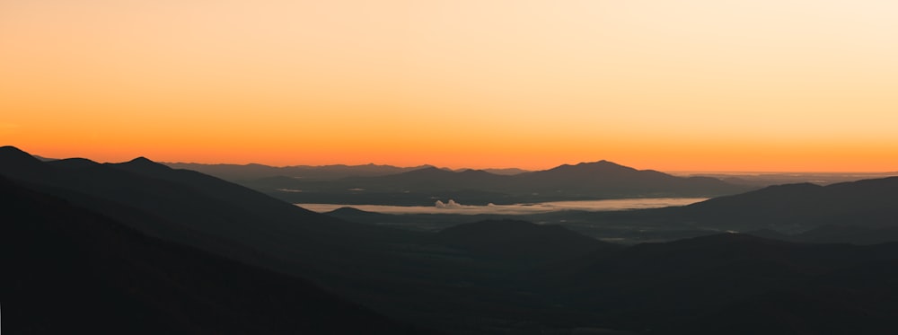 silhouette of mountains during sunset