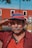man in red button up shirt wearing black and red fitted cap