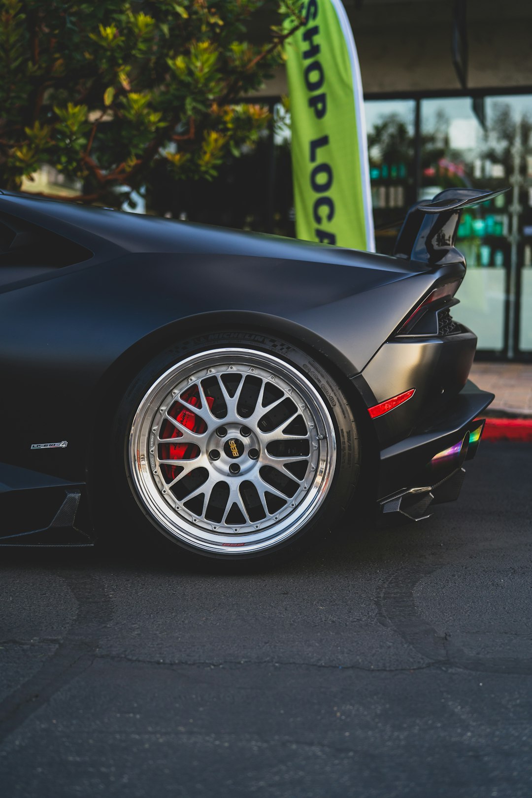 black ferrari 458 italia parked on gray pavement